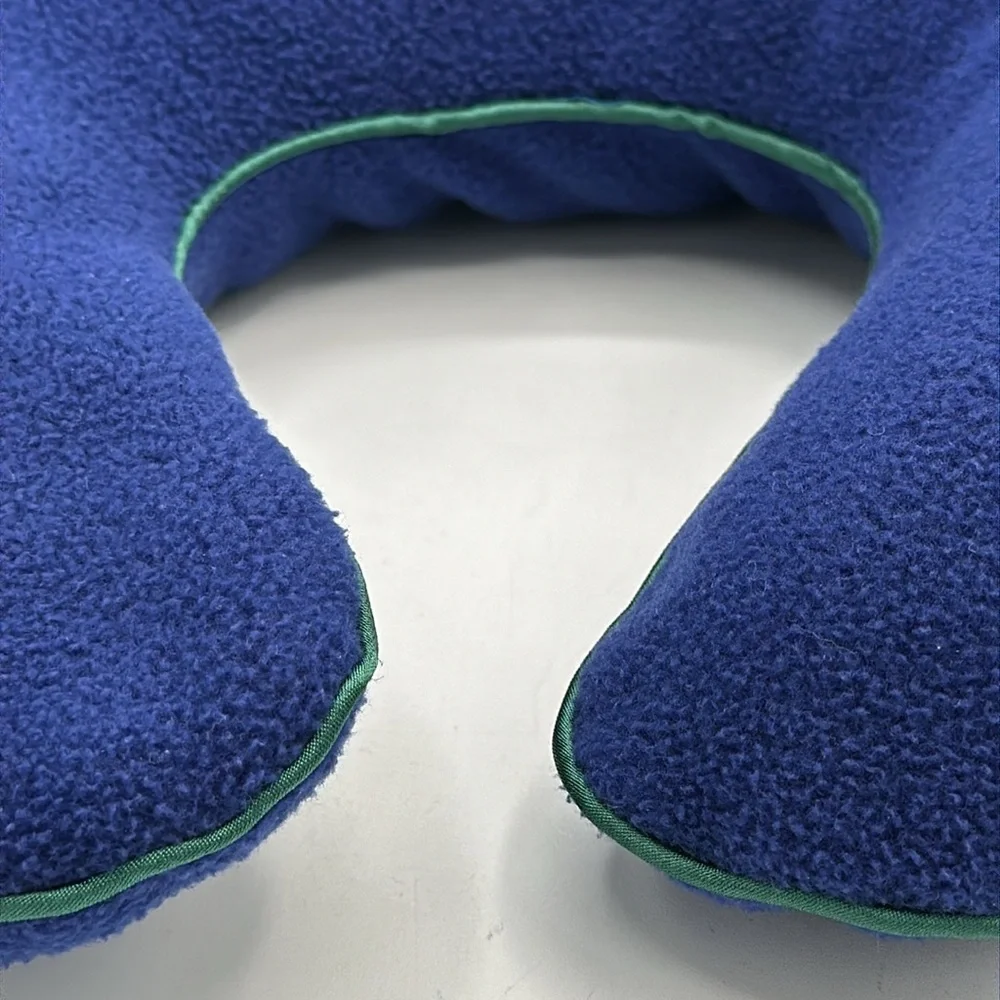 Austin House blue neck travel pillow with green piping